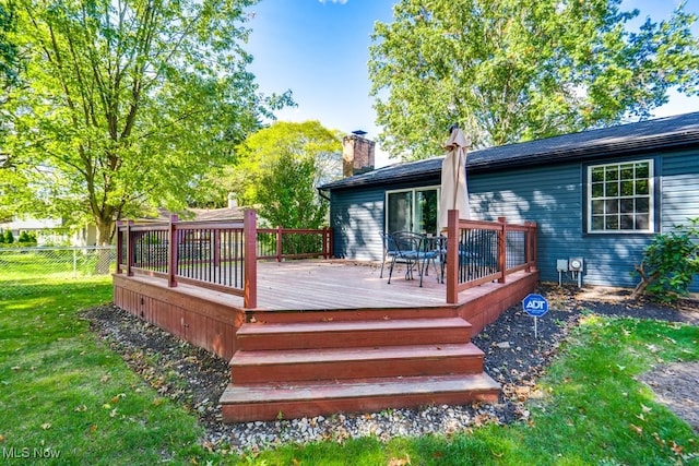 wooden deck with a yard