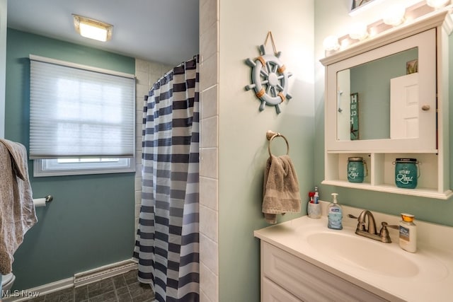 bathroom with vanity and curtained shower