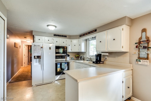 kitchen with stainless steel electric stove, white fridge with ice dispenser, sink, kitchen peninsula, and white cabinets