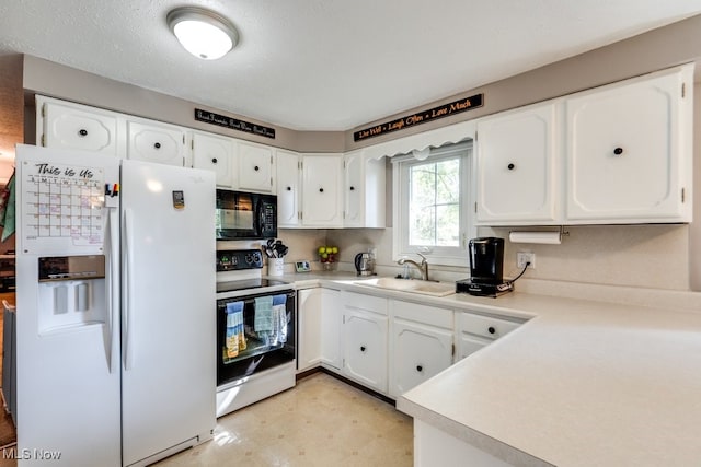 kitchen with sink, white appliances, white cabinetry, and a textured ceiling