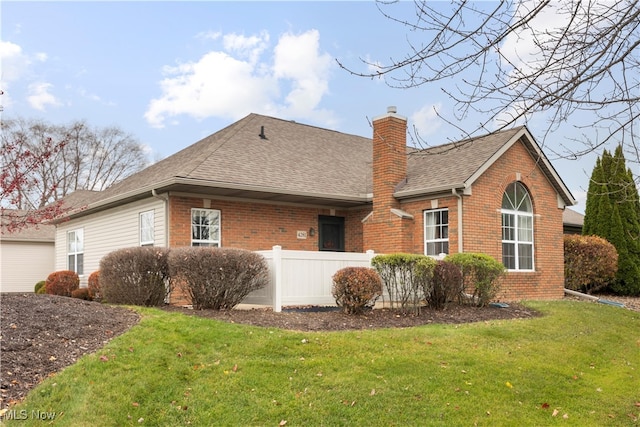 rear view of house with a lawn