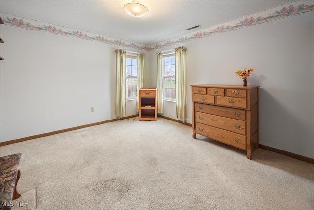 bedroom featuring light colored carpet