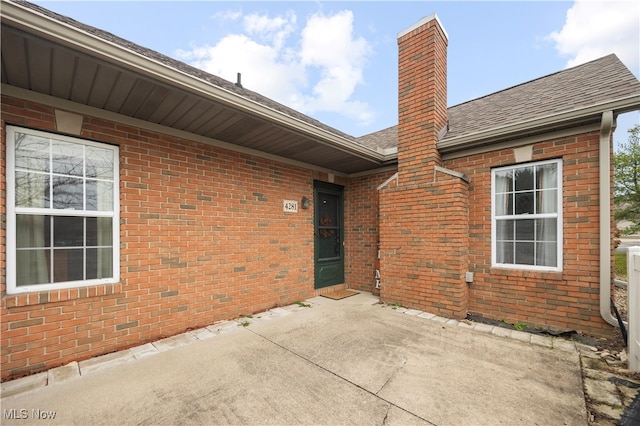 entrance to property with a patio