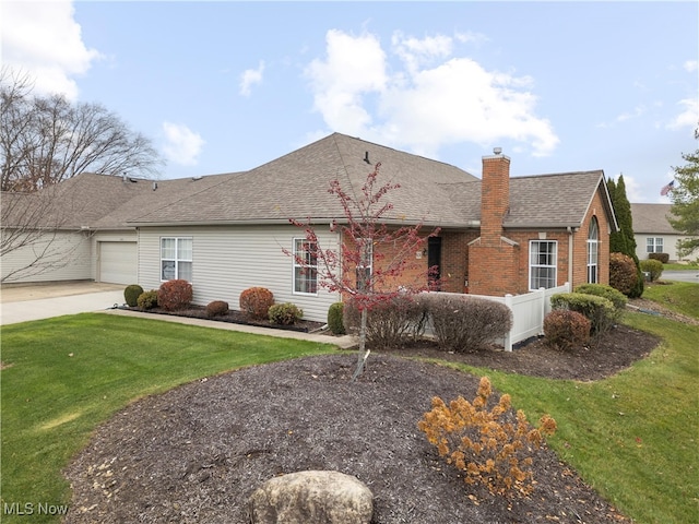 single story home with a garage and a front yard