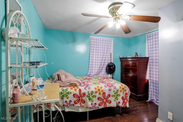 bedroom featuring ceiling fan and dark hardwood / wood-style flooring