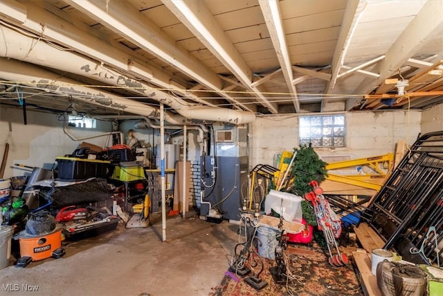 storage area with gas water heater and heating unit