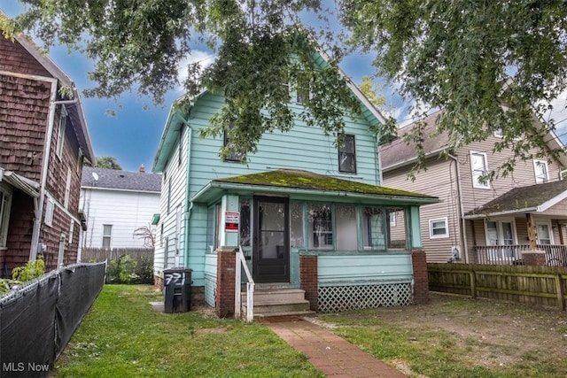 front facade with a front yard