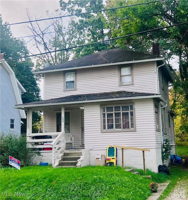 front facade featuring a garage and covered porch