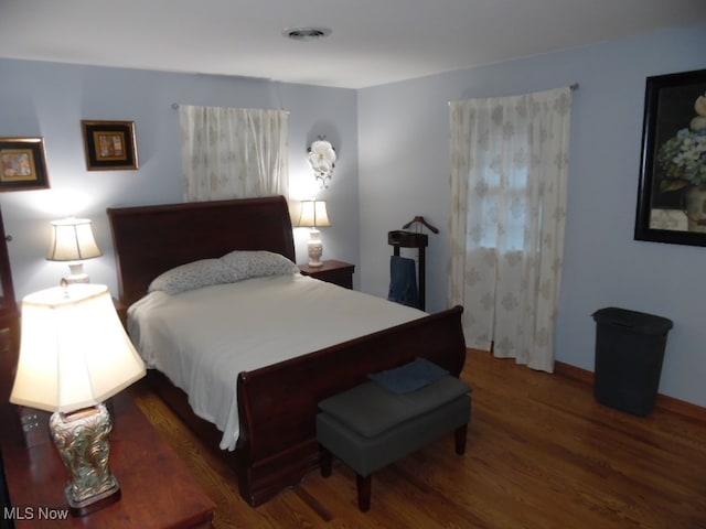 bedroom featuring dark hardwood / wood-style floors