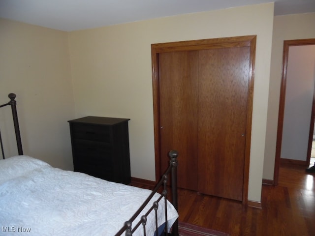 bedroom featuring dark wood-type flooring