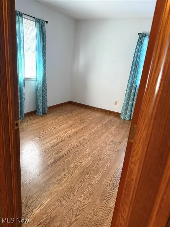 120 Woodcrest Dr, Marietta, OH 45750 - spare room featuring wood finished floors and baseboards
