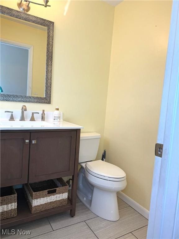 120 Woodcrest Dr, Marietta, OH 45750 - half bath featuring toilet, vanity, and baseboards