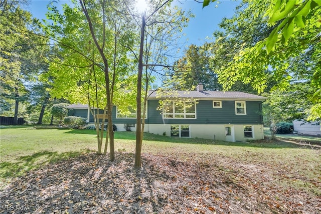 view of home's exterior featuring a lawn