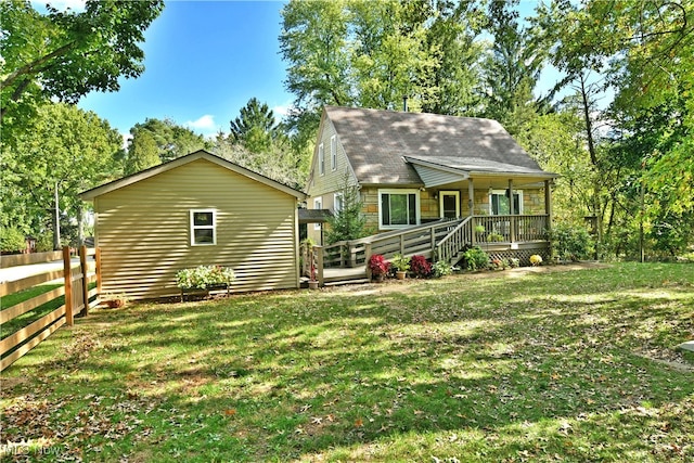 rear view of house with a lawn