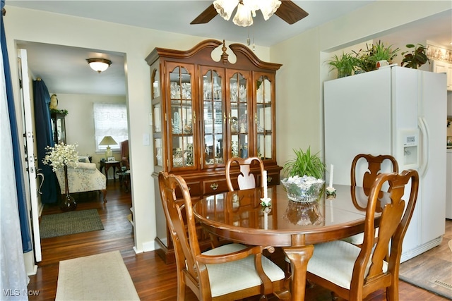 dining area featuring ceiling fan and dark hardwood / wood-style floors