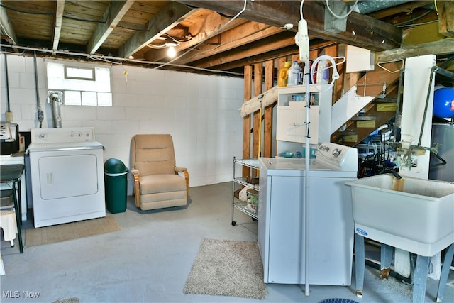 laundry area featuring sink and washer and dryer