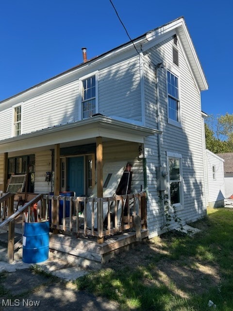 rear view of house with a porch