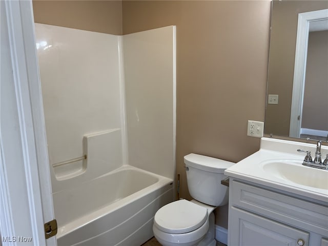 full bathroom featuring vanity, washtub / shower combination, and toilet