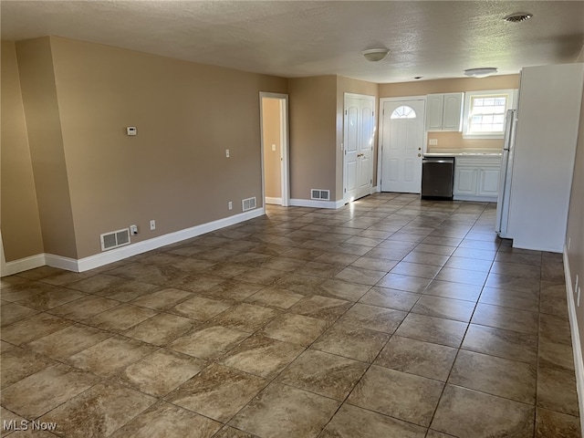 interior space with a textured ceiling