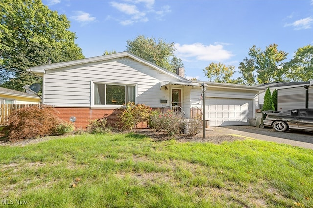 view of front of property with a garage and a front lawn