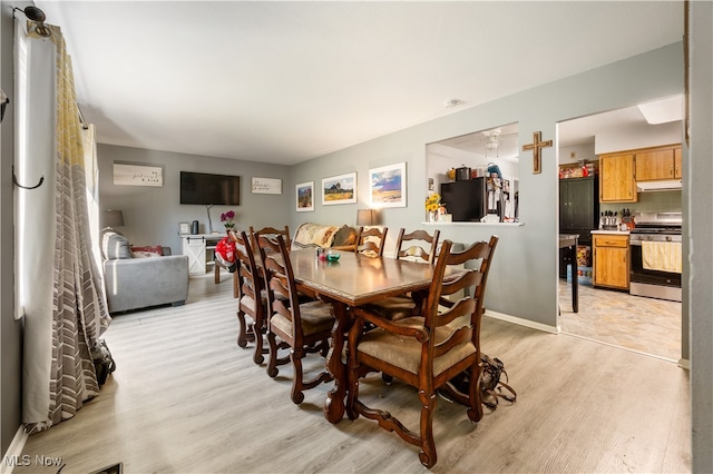 dining room featuring light wood-type flooring