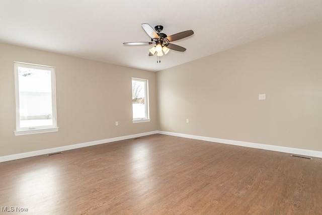 spare room featuring ceiling fan and hardwood / wood-style floors