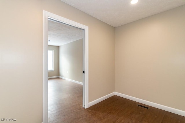 empty room featuring hardwood / wood-style floors