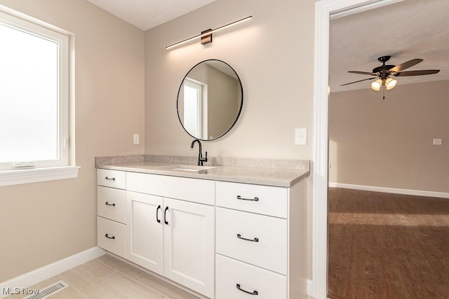 bathroom with ceiling fan, vanity, and tile patterned flooring