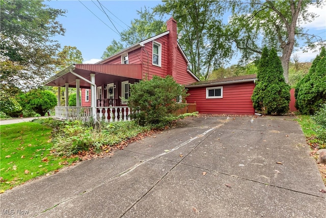 view of side of property with a porch