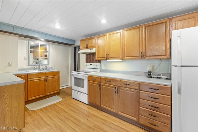 kitchen with backsplash, sink, light hardwood / wood-style flooring, and white appliances