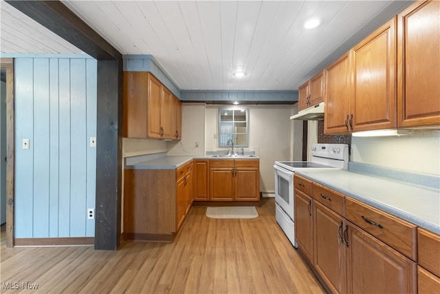 kitchen featuring sink, light hardwood / wood-style floors, and white electric stove