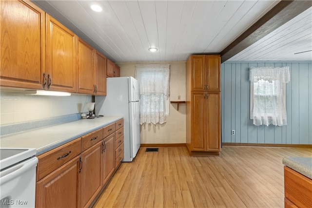 kitchen featuring wood walls, white appliances, light hardwood / wood-style floors, and wood ceiling