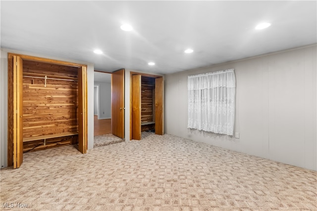 unfurnished bedroom featuring light colored carpet