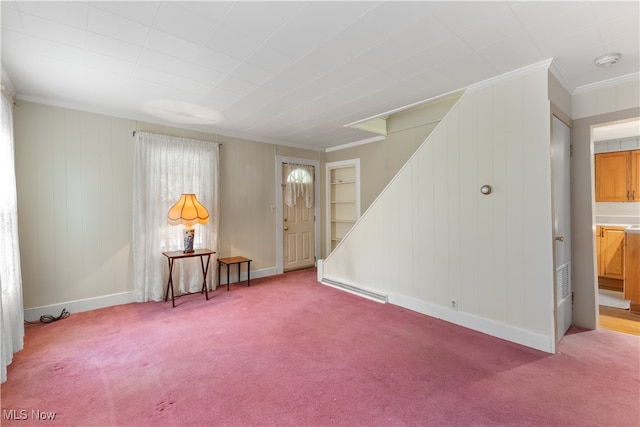 carpeted spare room with ornamental molding