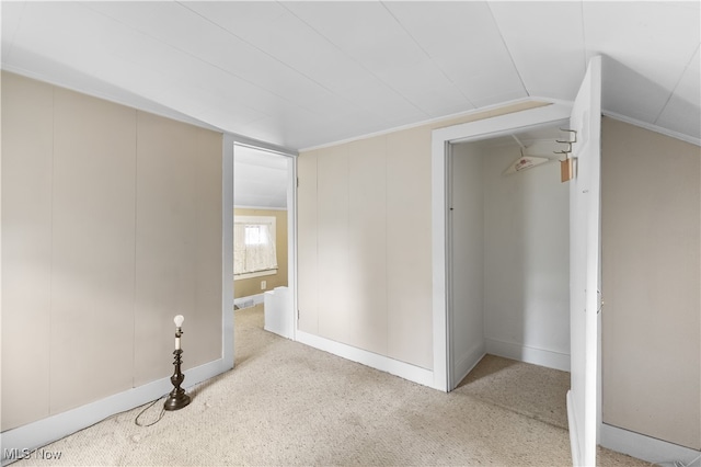 interior space with crown molding and carpet floors