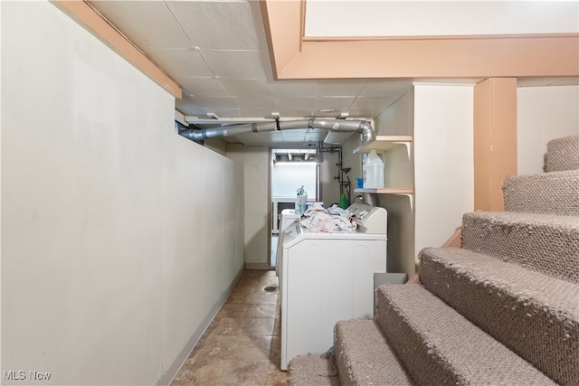 basement featuring washing machine and clothes dryer