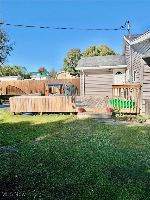 view of yard with a deck