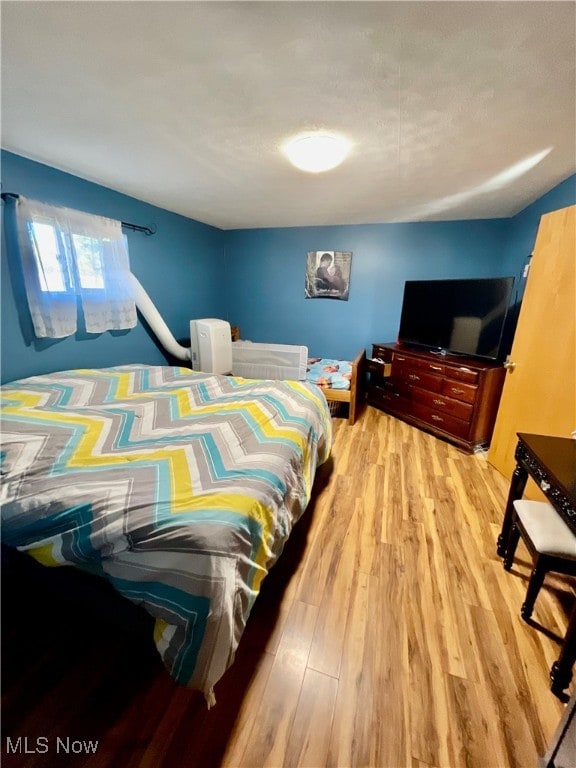 bedroom featuring light hardwood / wood-style floors