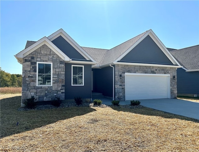 view of front of house with a front yard and a garage