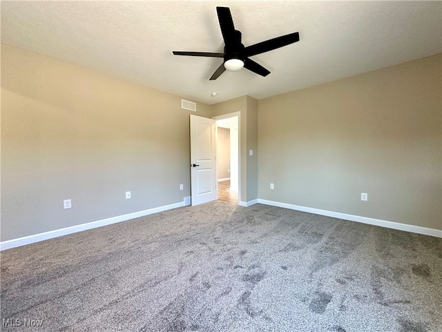 unfurnished room featuring carpet floors, a textured ceiling, and ceiling fan