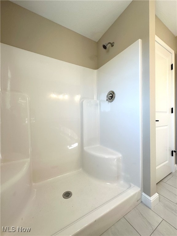 bathroom with walk in shower