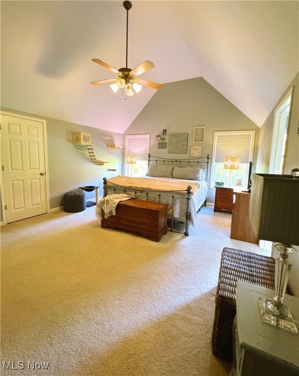 carpeted bedroom with lofted ceiling and ceiling fan