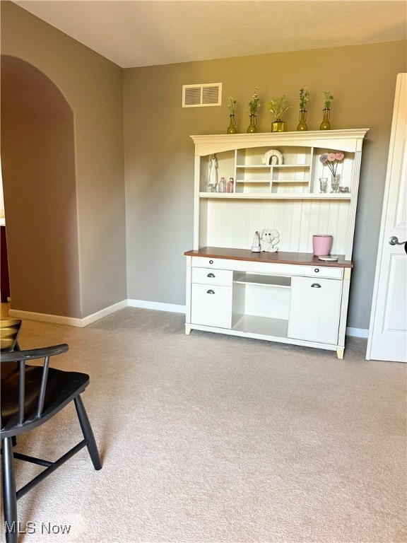 bar featuring light colored carpet