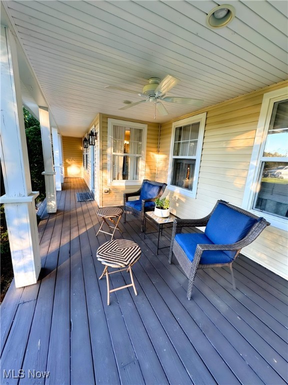 wooden deck with ceiling fan