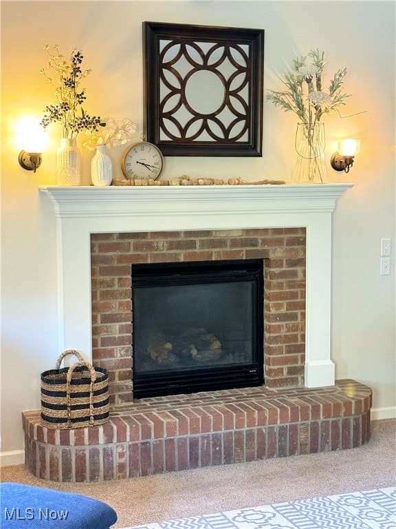 details with carpet floors and a brick fireplace