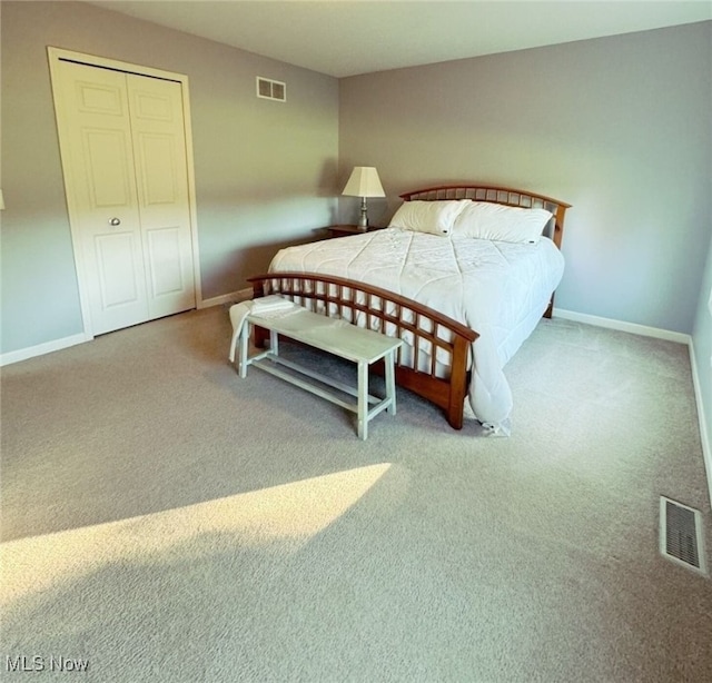 carpeted bedroom featuring a closet