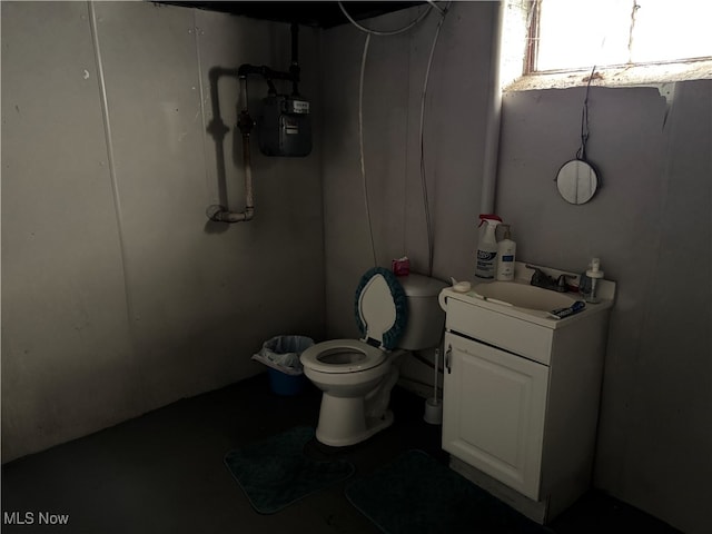 bathroom featuring toilet and vanity