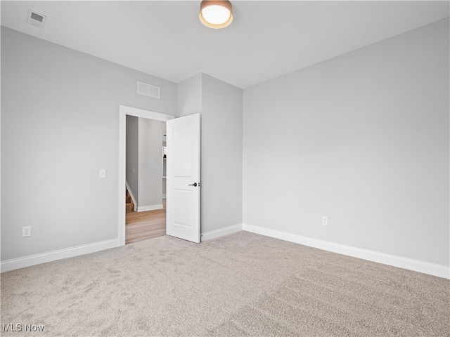 unfurnished room with carpet flooring