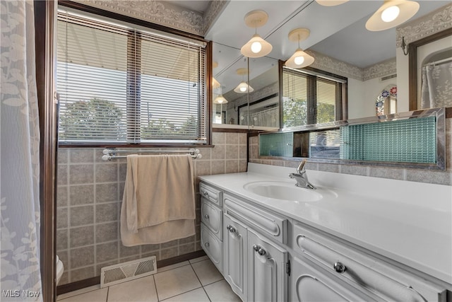 bathroom with vanity, tile walls, and tile patterned flooring