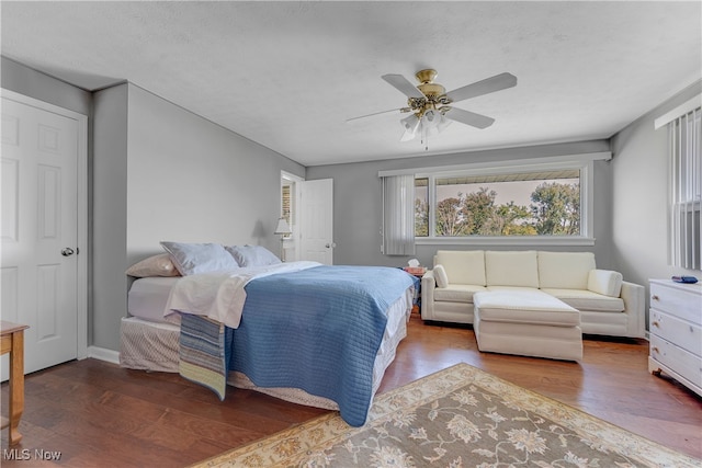 bedroom with hardwood / wood-style flooring and ceiling fan